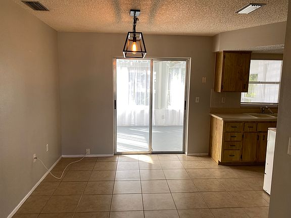 Dining area with new lighting fixture.
