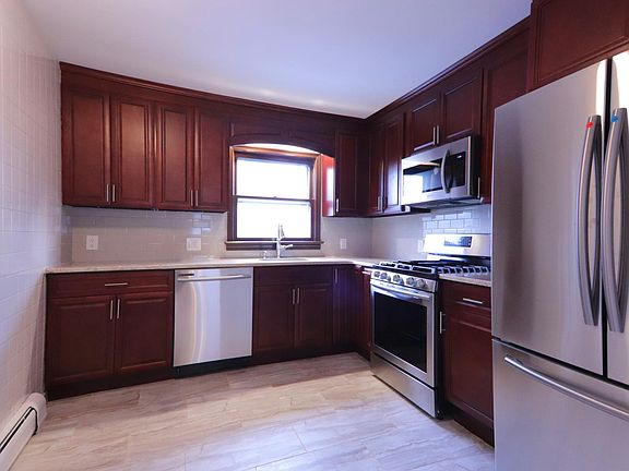Completely renovated kitchen with all new appliances, including dishwasher.