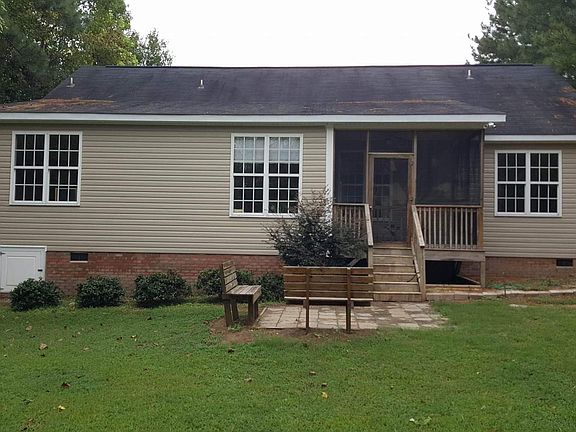 back of the house looking from the back yard to the front