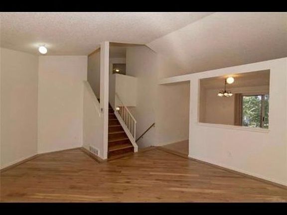 Living room to upstairs. Open to kitchen