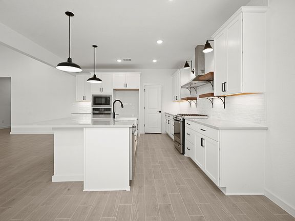 Kitchen with matte black pendant lighting