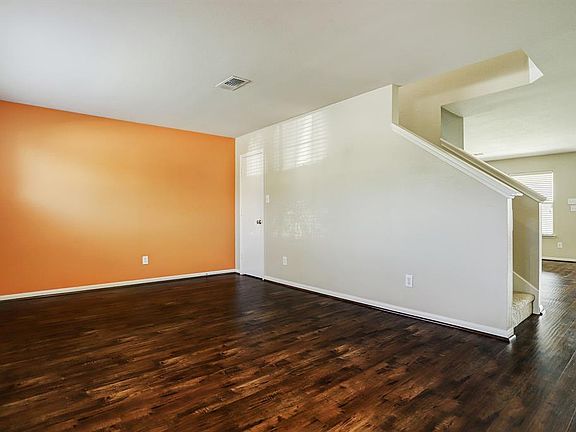 Gorgeous laminate wood floors throughout lead you from the entry to a bonus room that can be used as an office, formal living room, formal dining room, downstairs playroom, etc.