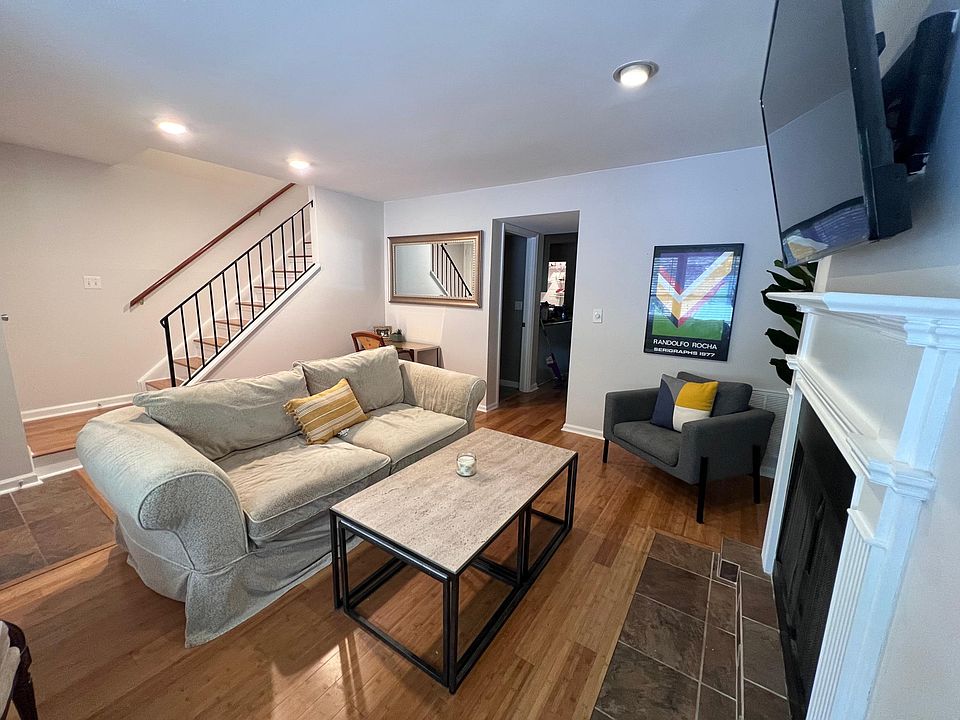 Enter into the living room, bamboo floors, faux fire place. Great space with plenty of room for seating and to watch TV