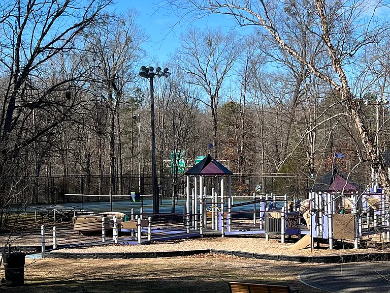 Park directly across the street with playground, basketball courts, walking trails.