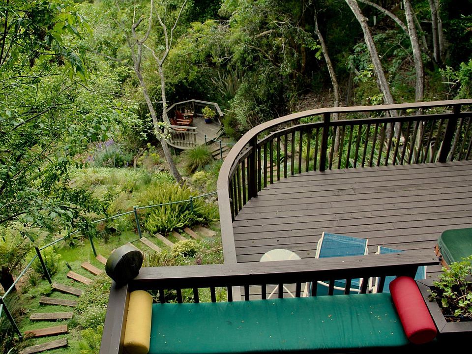 Apt's deck view of its 3 other decks and garden