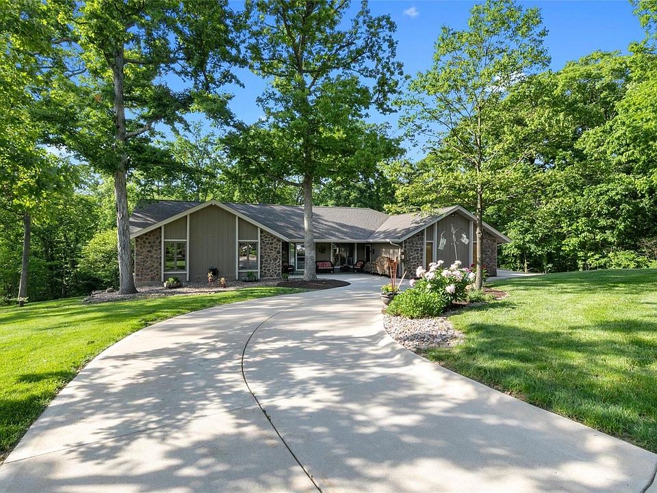 Beautiful ranch home with circle drive that has so much to offer!