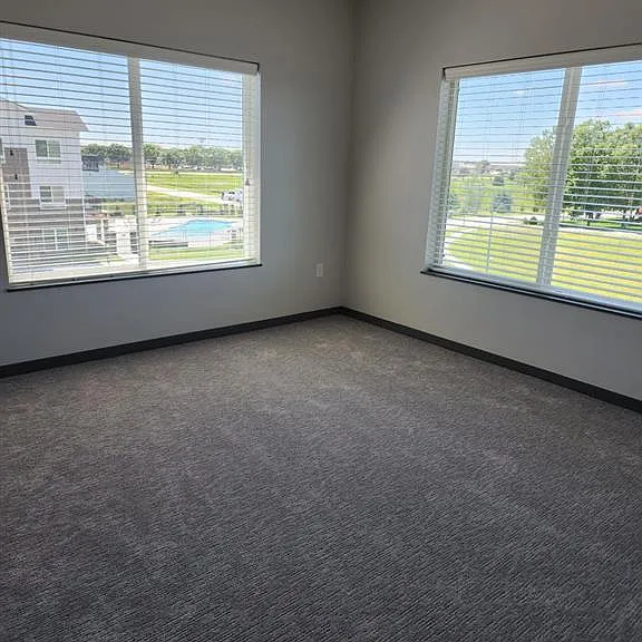 Bedroom with large windows at The Harbor.
