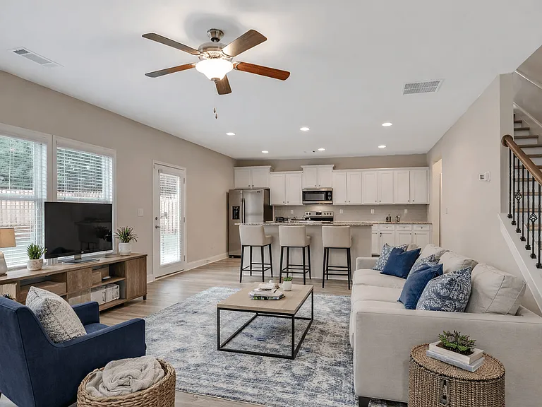 Living room with large window letting in a ton of natural light.