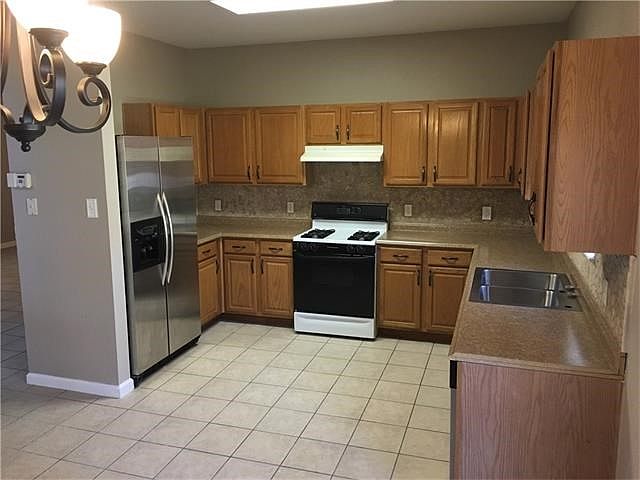 Kitchen stainless steel oven has not been installed.