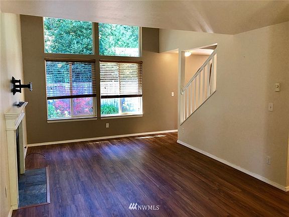 West facing wall of windows overlooking backyard 