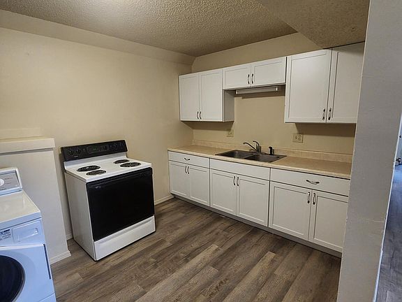 New washer and dryer, flooring, paint and cabinets in the kitchen
