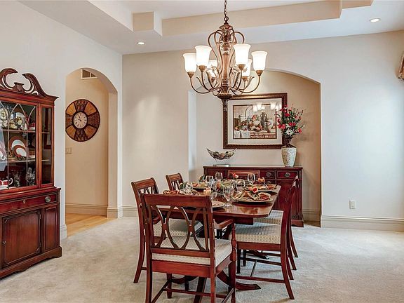 Arched doorways, 10' accented tray ceiling and recessed lighting.