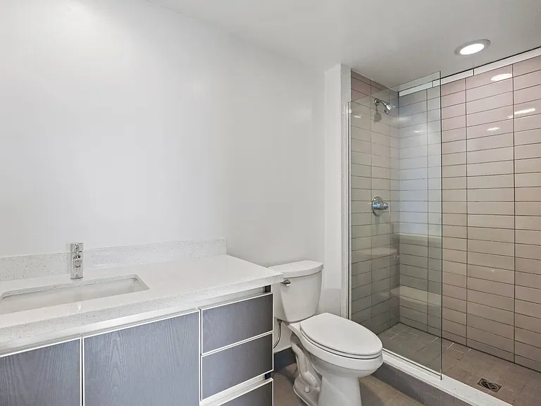 Bathroom with Walk-In Shower, and Vanity with Cabinet and Drawers