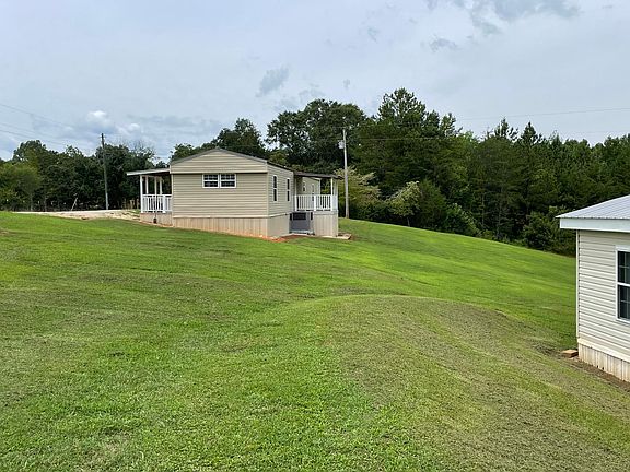 Side view showing front and rear covered decks.