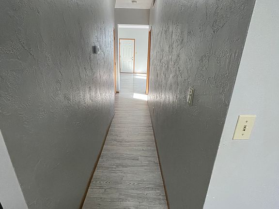 The hallway that creates the path to kitchen as you advance through out.