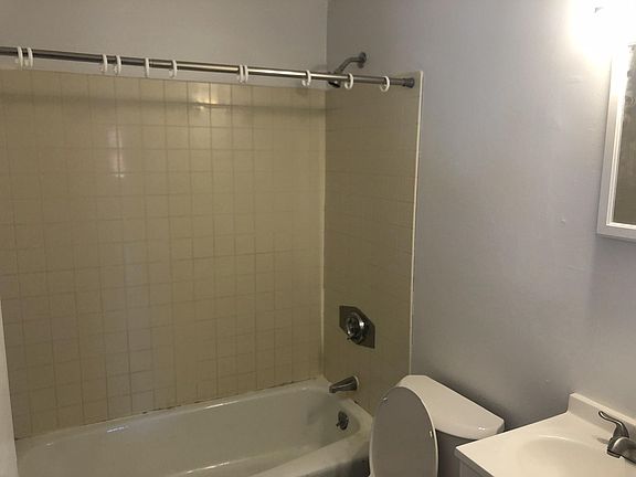 Bathroom has been updated with new tile and vanity