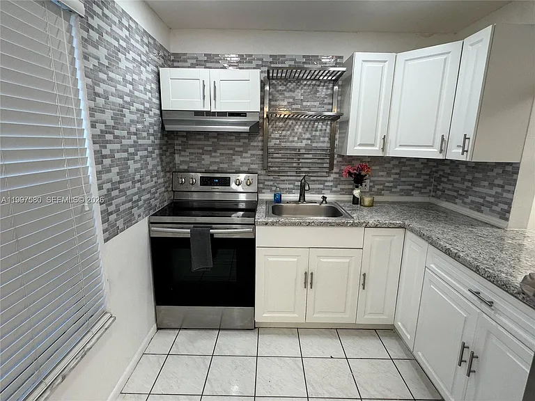 6150 NW 62nd St #106 — Photo 1