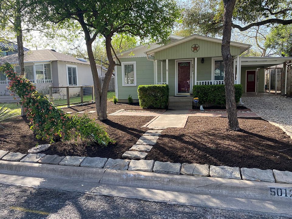 Front of the house has a front porch with rockers. Carport has lockable 6 foot tall gate.