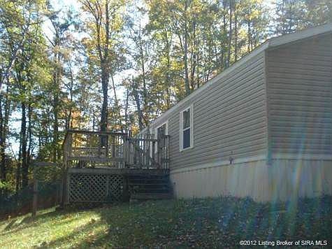 Front of home. Which is located in the middle of the property. surrounded by woods to give you all t