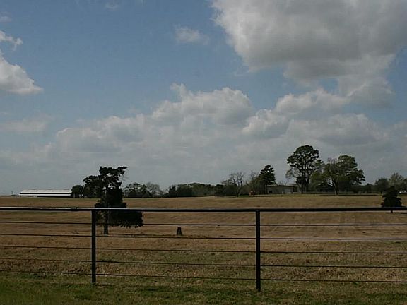 Approx. 20+/- Pipe Fenced acres with updated farmhouse, large metal barn on slab with gym/office, 2 deep freezes and large cooler.  Fenced and cross fenced.