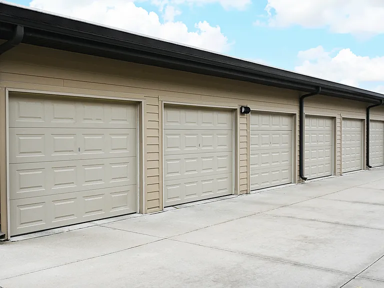 A row of closed garage doors in a row.
