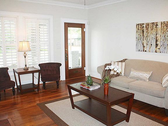 Another view of the living room. Glass front door opens from the spacious front porch.