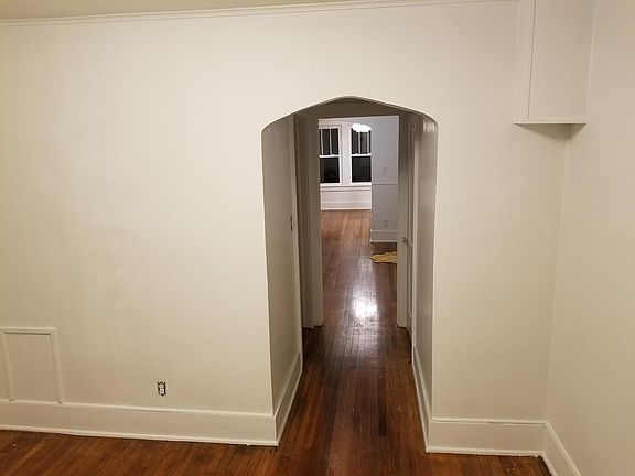 Bedroom looking to Dining Room. Beautiful Arched Doorways
