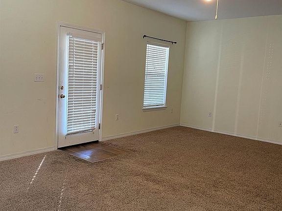 Living Room/Dining Room toward front door . . .