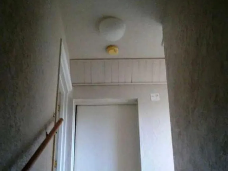 Looking up from stairs to top floor