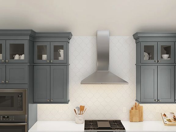 Kitchen with stainless steel hood