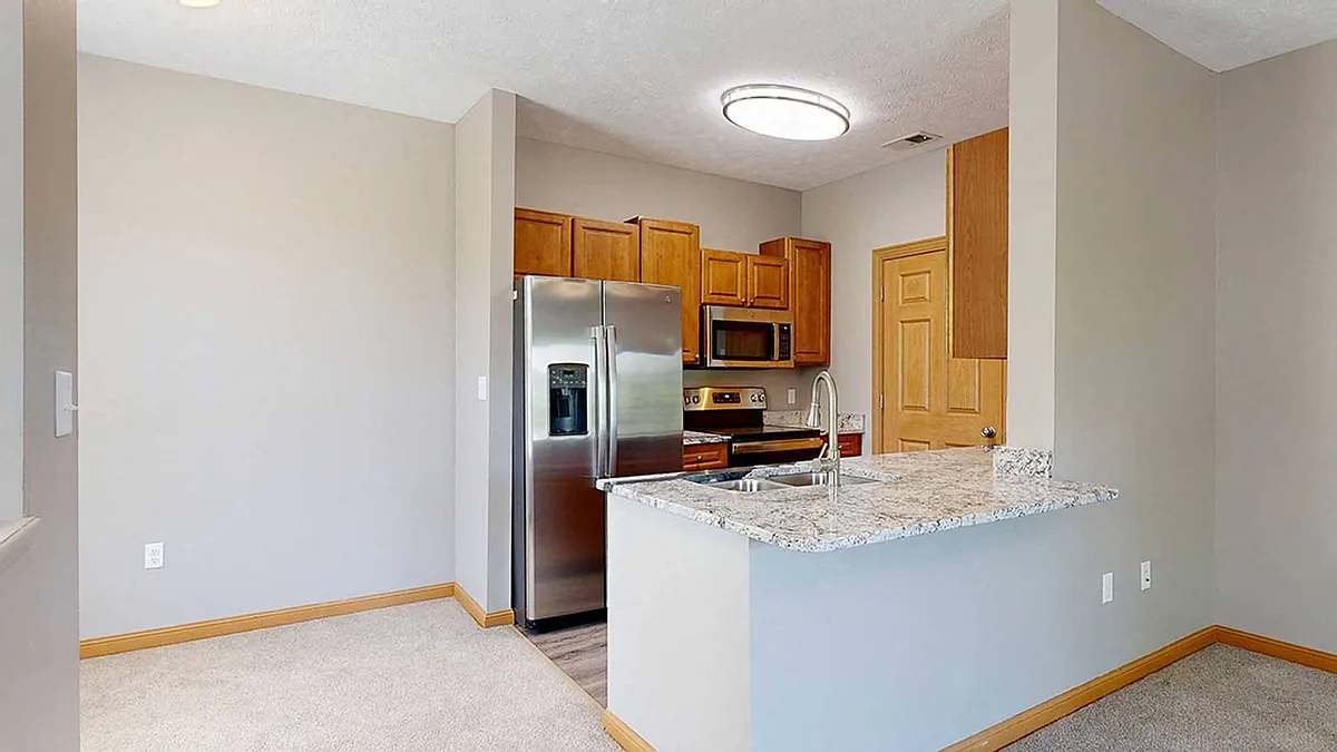 Our renovated kitchens are designed with functionality in mind, featuring stainless steel appliances, granite countertops, and plenty of storage space. - Stone Creek Villas