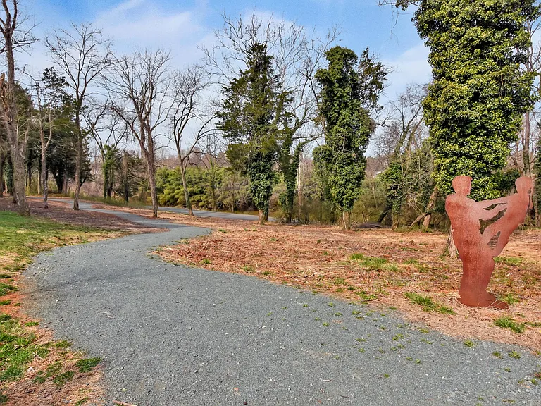 Walking trail, leading to running trails along Rivanna River, connecting to Darden Towe Park.