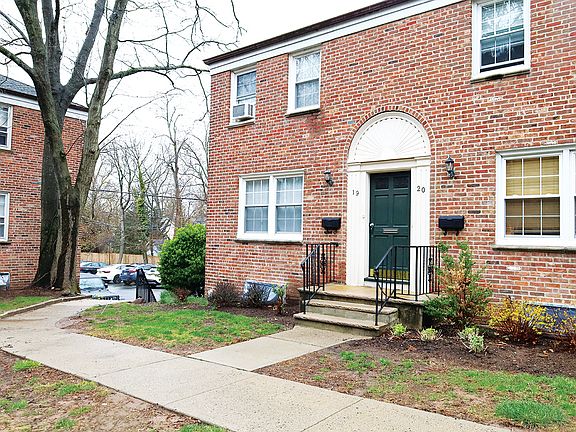 Sidewalk leading to parking lot to Morris Ave or attached garage.