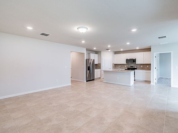 Spacious Gathering Room Open to Kitchen