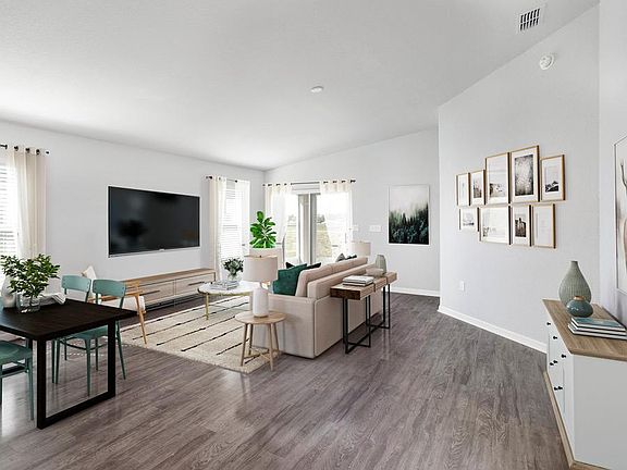 Enjoy a spacious and open living area with volume ceilings - Cambry home plan by Highland Homes