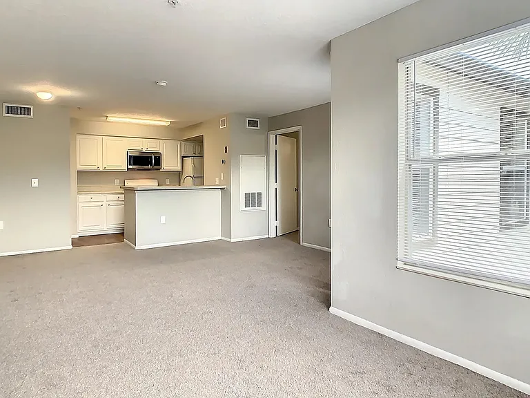 Our large living rooms feature plush carpeting and ample natural light from our oversized windows.