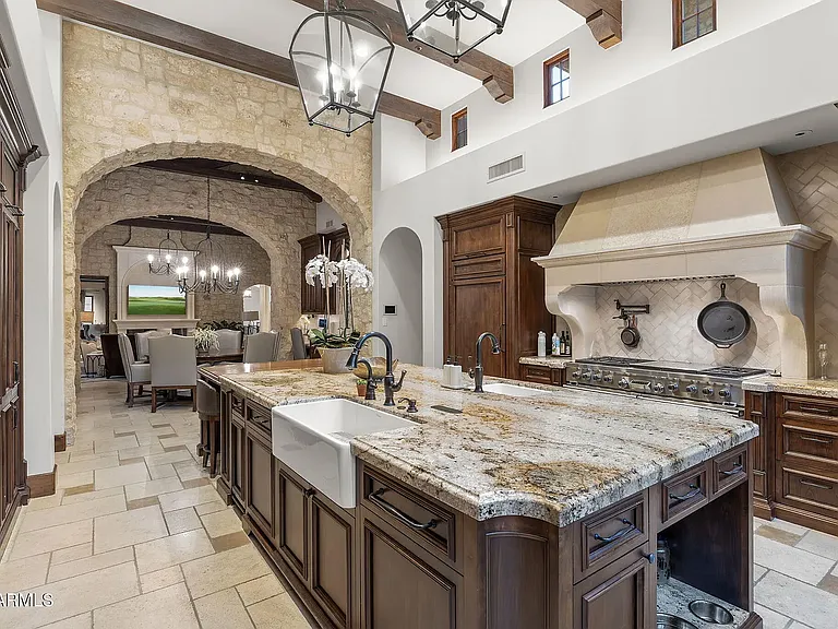 Chef's kitchen with expansive island and premium finishes.
