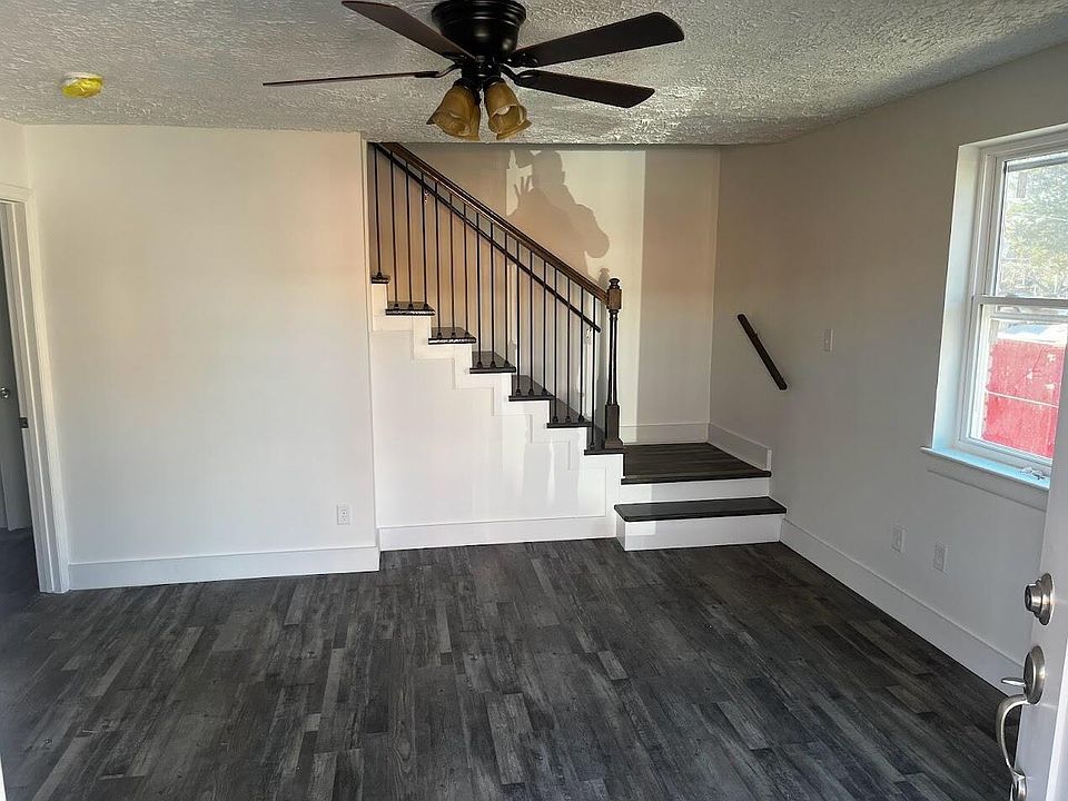 Living Room and Stairs, all solid floors (no carpet).