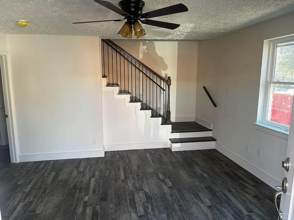 Living Room and Stairs, all solid floors (no carpet).