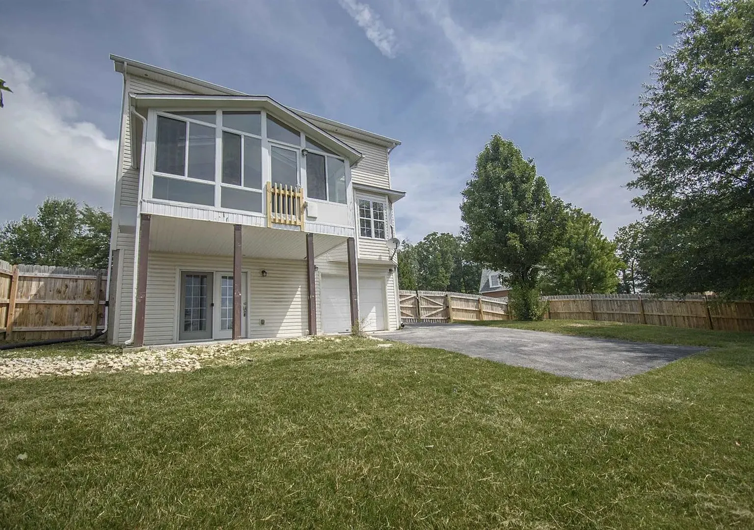 Spacious Home with Beautiful Sunroom & Lawn Care Included — Photo 2