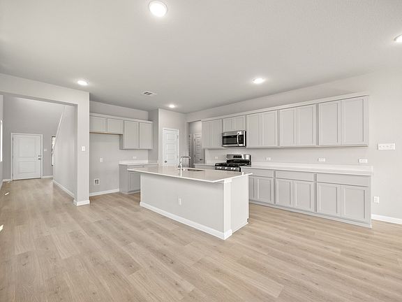 Kitchen in the Elm II home plan by Trophy Signature Homes - REPRESENTATIVE PHOTO