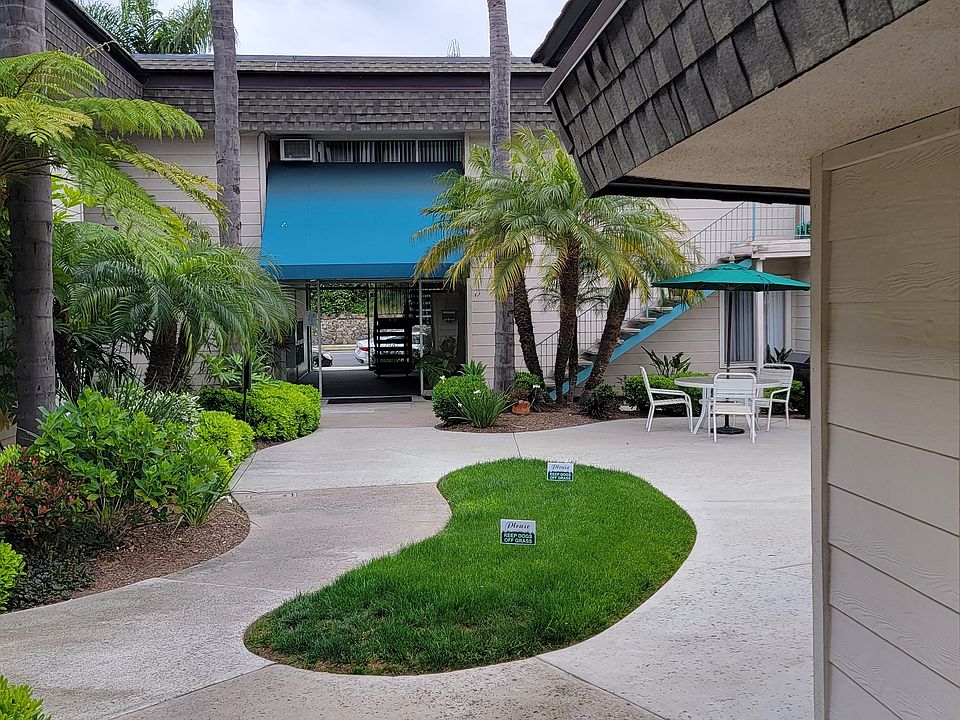 Looking back at courtyard with lush landscaping at La Mesa Village Apartments in La Mesa, California.