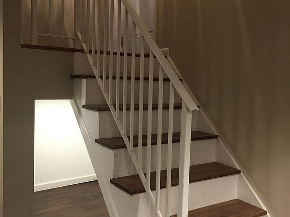 Beautiful entry area with custom stair rail, Bonus area with