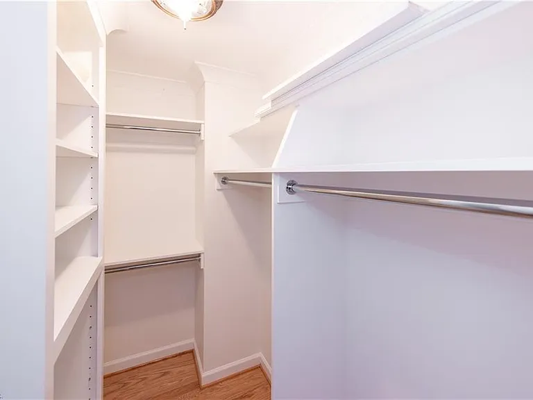 First king-size bedroom walk-in closet.
