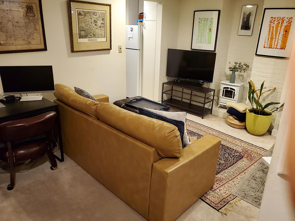 Living Room when occupied by previous tenant. Kitchen starts to left top