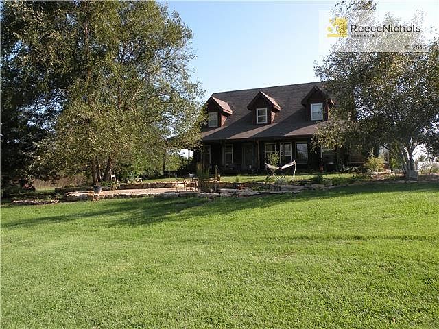 Gorgeous 4 bedroom home on 20 acres should be your new resort home!  No, the landscaping doesn't look like this right now, but it will very soon!