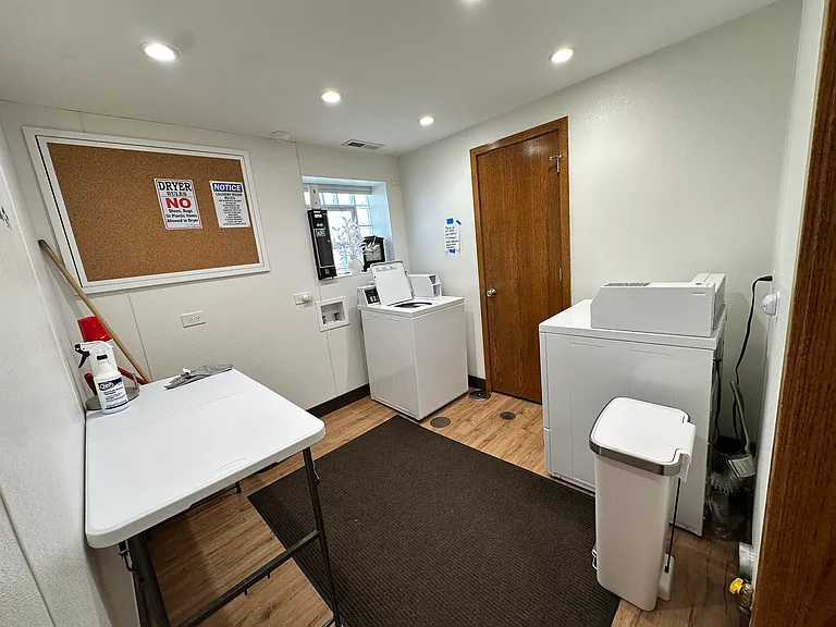 Shared coin laundry on-site in the basement area.