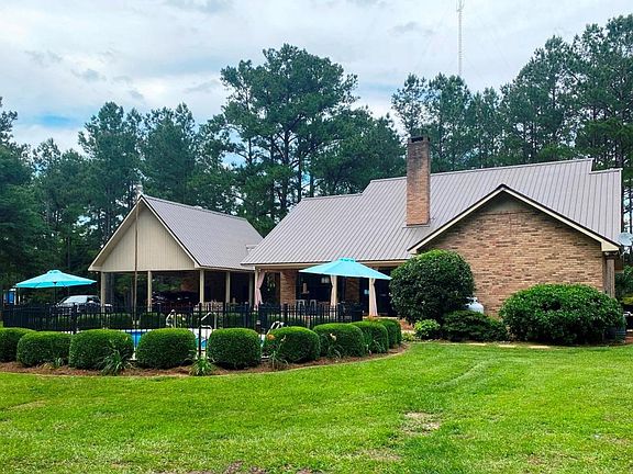 rear of house with outdoor living area