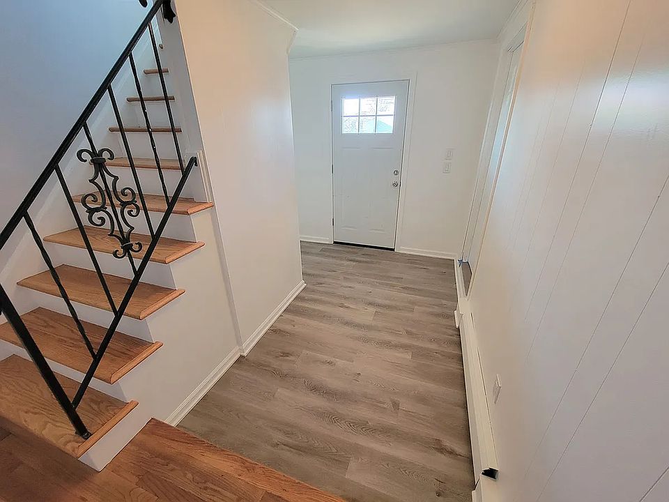 Entryway. If you enter through the back door there is one flight to walk up.