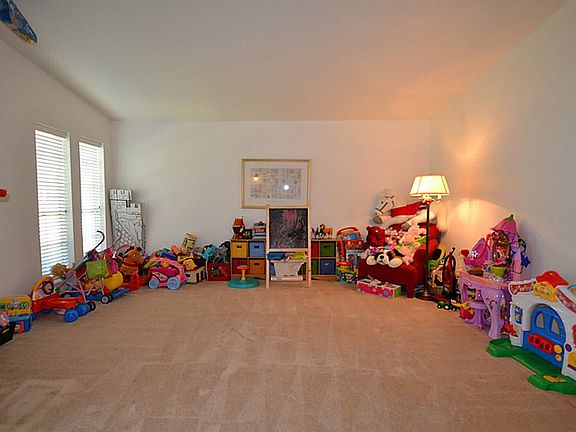Formal living room accented by raised ceilings.